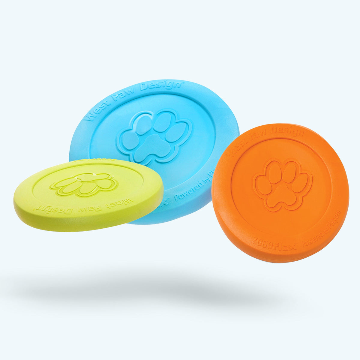 Three colorful dog toys with paw prints on a white background