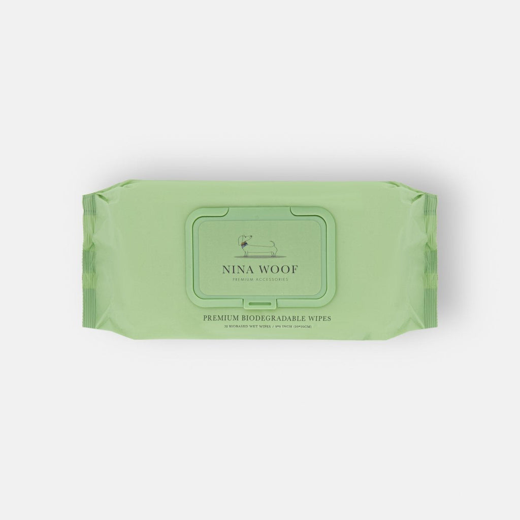 Green package of Nina Woof wipes on a white background