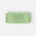 Green package of Nina Woof wipes on a white background