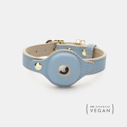 Light blue leather dog collar with gold accents on a white background
