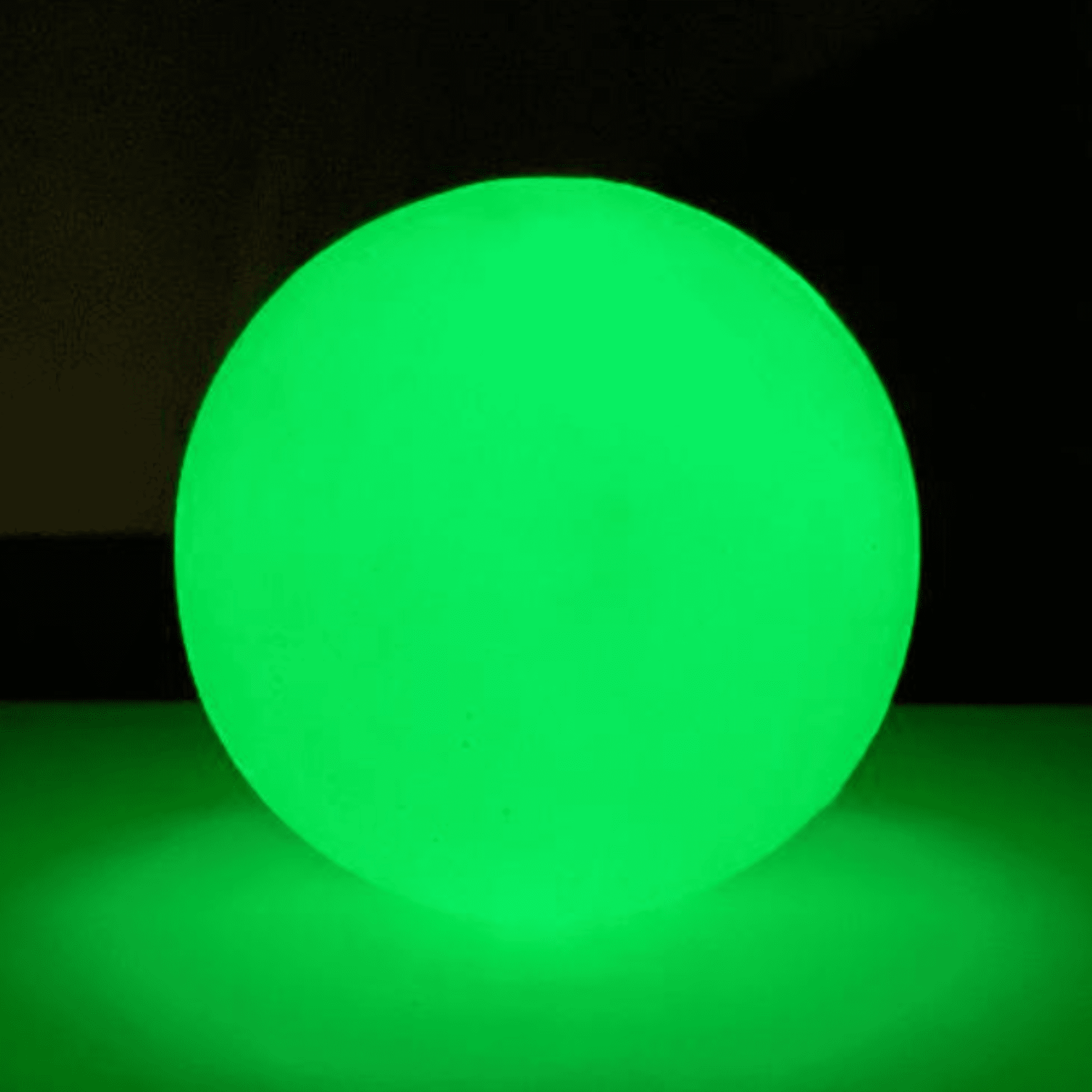 Glowing green sphere on a dark background