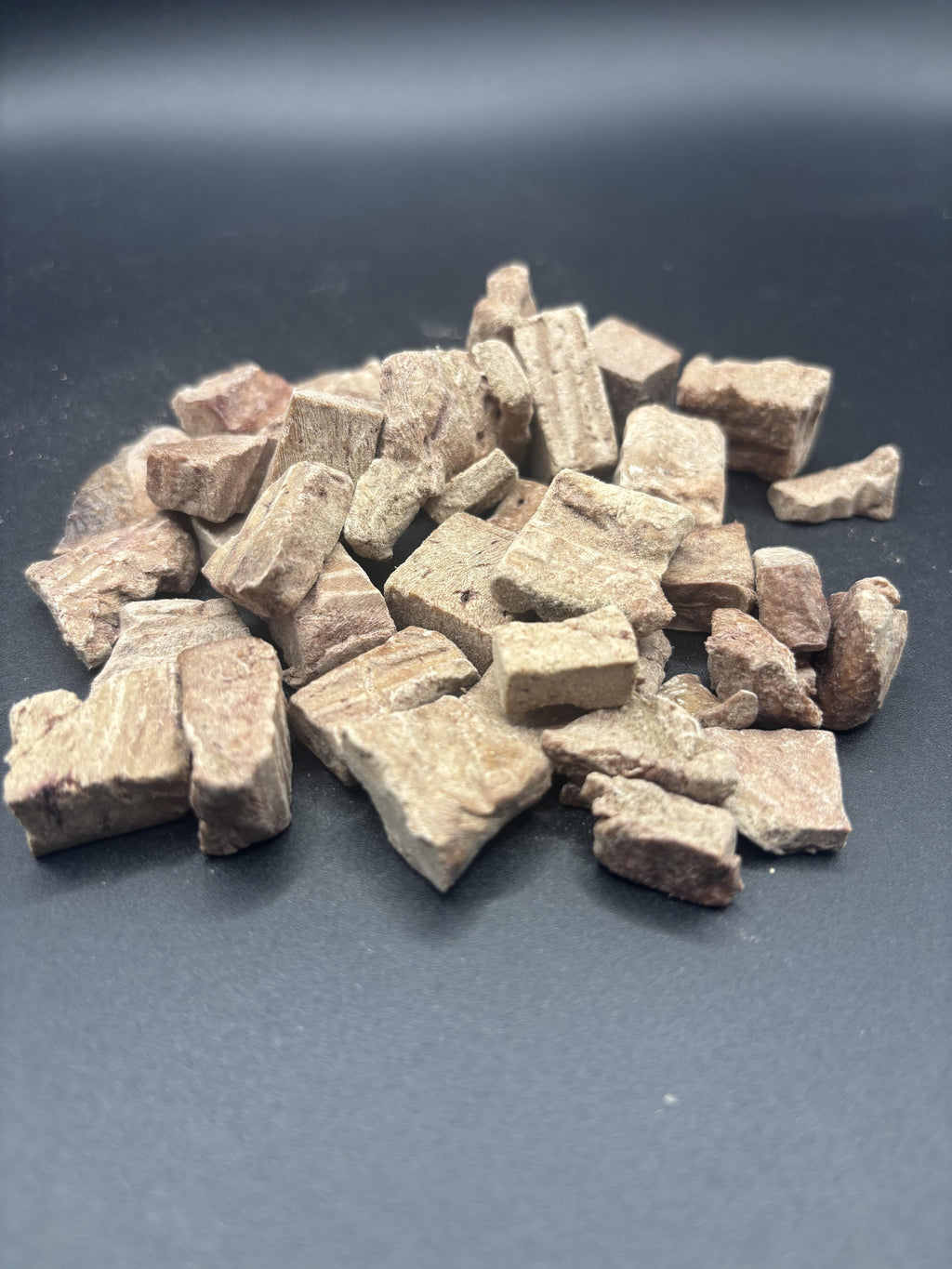 Brown stone chips on a dark gray background