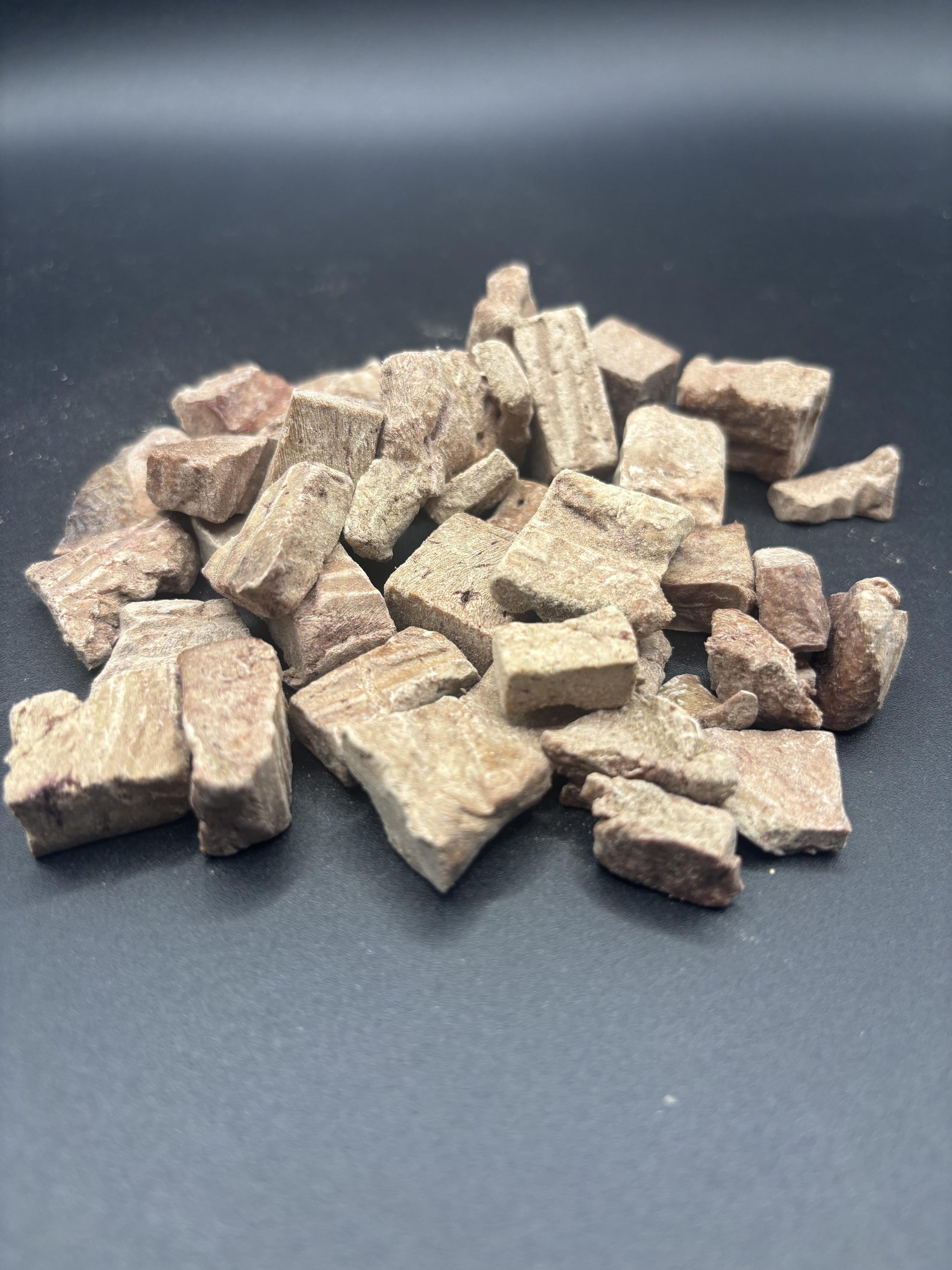 Brown stone chips on a dark gray background