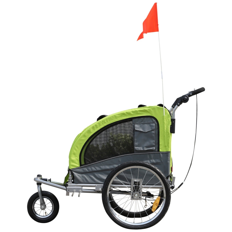 Green and gray bike trailer with a red flag on a white background