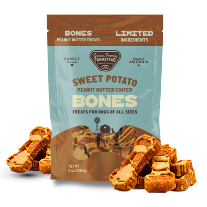 Package of Sweet Potato Peanut Butter Coated Bones dog treats with treats displayed in front.