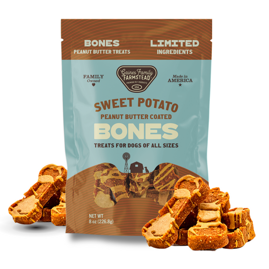 Package of Sweet Potato Peanut Butter Coated Bones dog treats with treats displayed in front.