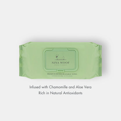 Green package of Nina Woof wipes on a white background