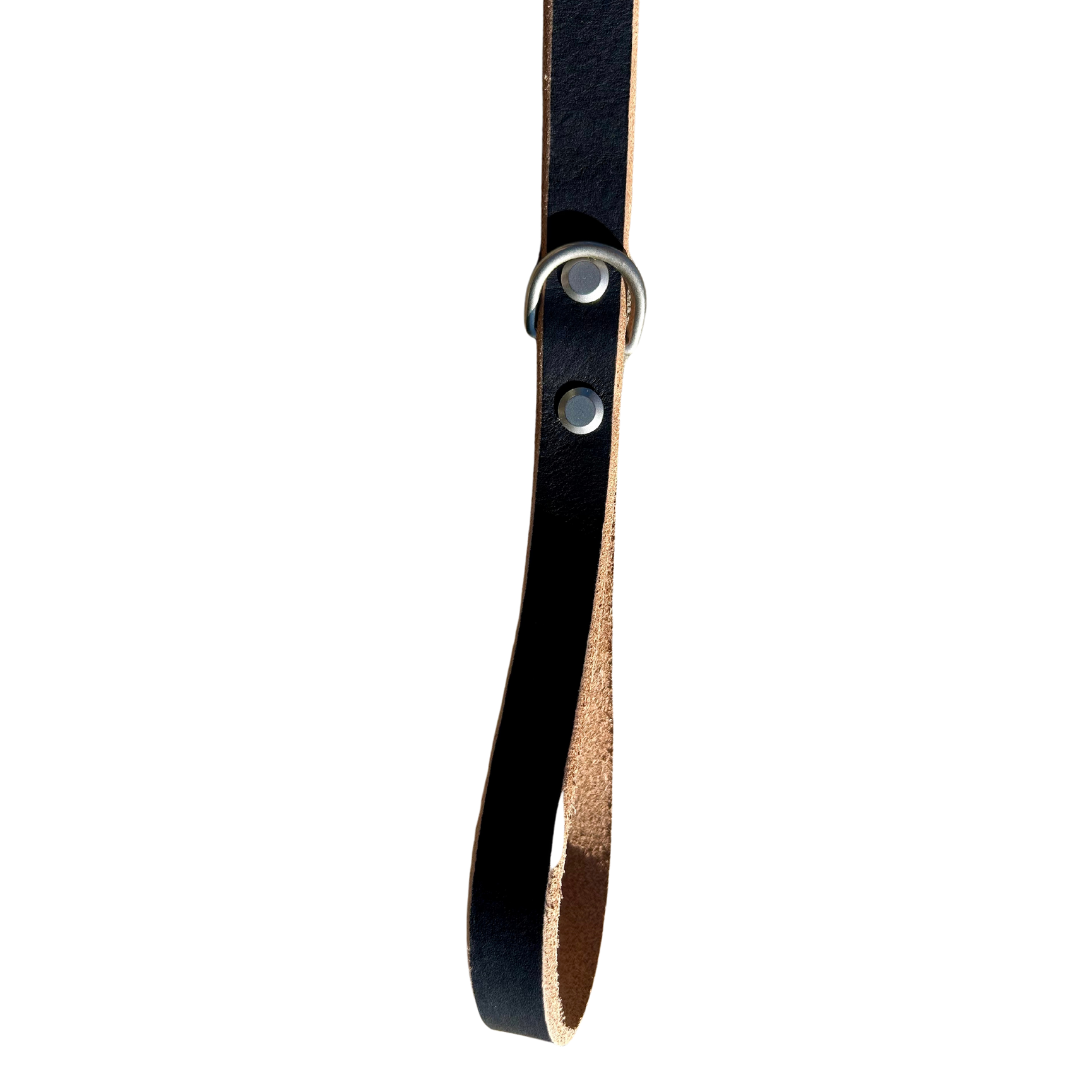 Black leather strap with a metal buckle on a white background