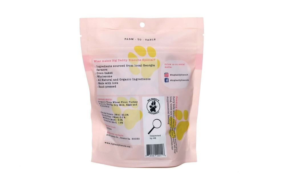 Pink pet product packaging with label on a white background